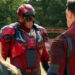 David Denman's Keith Smith wearing Captain Triumph armor while facing John Cena's Peacemaker and Jennifer Holland's Emilia Harcourt on Peacemaker