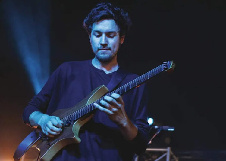 Australian guitarist Plini Roessler-Holgate performing live on stage during Download Festival at Donington Park on June 9, 2018. (Photo by ) .