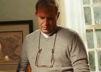 John looking down at his hands in The New Daughter