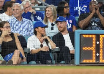 Magic Johnson (right) and Sandy Koufax (left) were relegated to the second row at the fixture