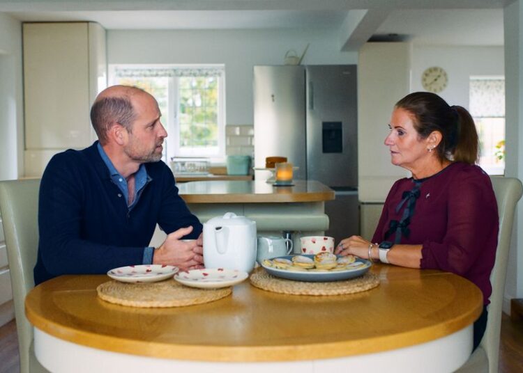 Prince William chatting with Rhian Mannings in her kitchen