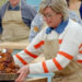 Contestant Nicky Laceby picks up her beaver cake in The Great British Bake Off