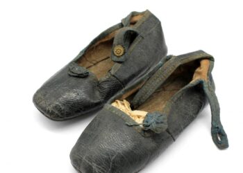 A pair of leather booties once worn by Queen Victoria (1819-1901) as a baby when known as Princess Alexandrina, approx. 12.2cm long. The shoes have an estimate of £300-£500.  // Baby clothes worn by Queen Victoria are set to make more than £1,000 when <i>(Image: Hansons Auctioneers / SWNS)</i>