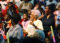 Audience members react to performers at the UniverSoul Circus during a performance in Newark, N.J., on May 12, 2004. UniverSoul Circus, a traveling one-ring circus, was founded in 1994 to bring acrobats, high-wire walkers, clowns and other performers to urban audiences. (Associated Press)