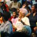 Audience members react to performers at the UniverSoul Circus during a performance in Newark, N.J., on May 12, 2004. UniverSoul Circus, a traveling one-ring circus, was founded in 1994 to bring acrobats, high-wire walkers, clowns and other performers to urban audiences. (Associated Press)