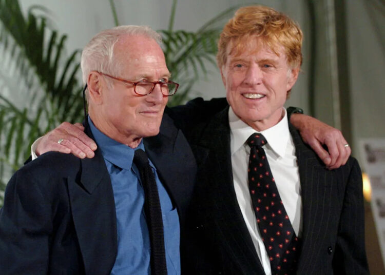 Prolific actors Paul Newman, left, and Robert Redford pose for photos arm in arm during the 2004 Westport Country Playhouse gala in Greenwich. (Christian Abraham/File Photo)