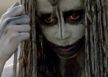 Rae Dawn Chong as Ika looking downward in Quest for Fire