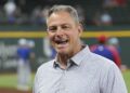 Jun 21, 2024; Arlington, Texas, USA; Texas Rangers general manager Chris Young (left) and Kansas City Royals general manager J.J. Picollo (right) talk before the game against the Kansas City Royals at Globe Life Field. Mandatory Credit: Jim Cowsert-Imagn Images