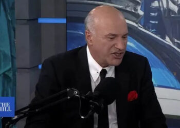 kevin o'leary speaking to a microphone