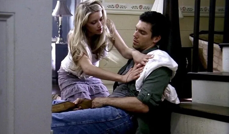 Amber Heard as Mandy Lane tends to Anson Mount as Garth in All the Boys Love Mandy Lane
