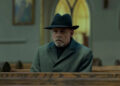 Pym sitting in a church pew in The Fall of the House of Usher