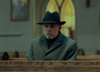 Pym sitting in a church pew in The Fall of the House of Usher