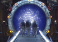 The SG-1 crew walk inside one of the titular devices in Stargate SG-1