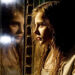 Abby stares through her reflection in Let Me In