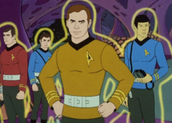 Scotty, McCoy, Kirk, and Spock in yellow force fields in Star Trek: The Animated Series