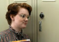 Shannon Purser as Barb standing in front of her locker in Stranger Things season 1