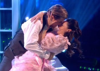 Nikita Kuzman and Amber Davies open the show with an American Smooth (BBC One screenshot)
