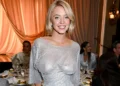 Sydney Sweeney smiles in a sparkling sheer silver gown at Variety’s Power of Women event in Los Angeles.