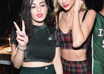 Taylor Swift has added fuel to the rumours that her new song Actually Romantic is about fellow pop star Charli XCX after fans speculated they were feuding (pictured together n 2014)