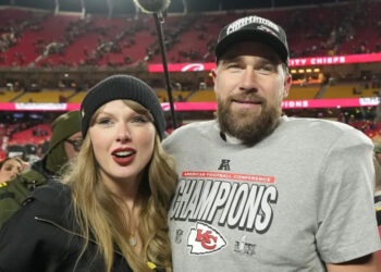Kansas City Chiefs tight end Travis Kelce and singer Taylor Swift stand on the field after the Chiefs defeated the Buffalo Bills in January. File Photo by Jon Robichaud/UPI.