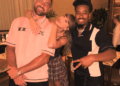 Taylor Swift posed with a fan in an anti-Showgirl plaid mini skirt