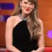 Taylor Swift wearing a black halter dress on the graham norton show