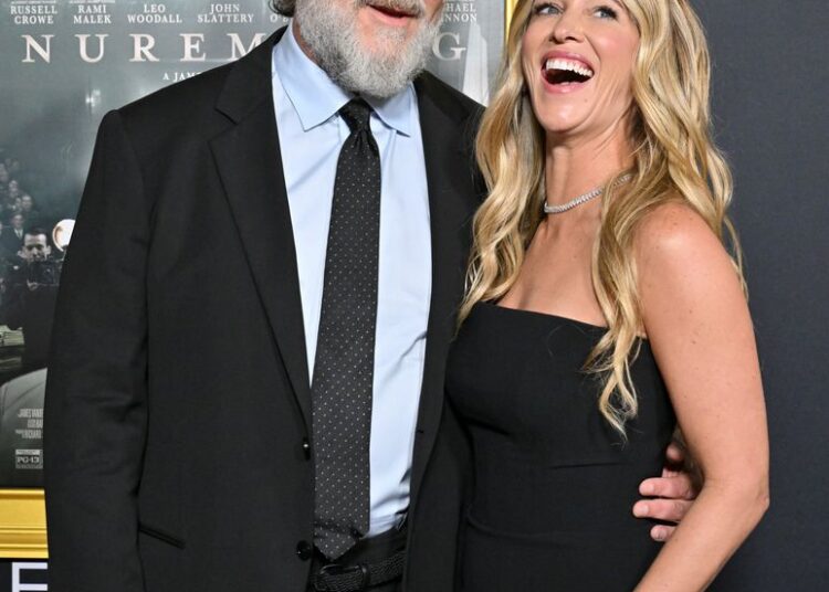 Russell Crowe and Britney Theriot attend the 2025 AFI FEST premiere for Nuremberg