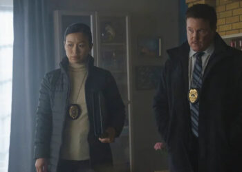Annie Chang as Sophie Song and Lochlyn Munro as Larry Fitzgibbon standing around at a crime scene in Peacemaker season 1