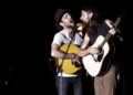 Scott and Seth Avett of The Avett Brothers perform near the front of the catwalk at Common Ground Music Festival on July 13, 2013.