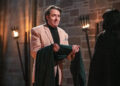 Jonathan Ross accepts the traitors cloak from Claudia Winkleman. (BBC/Studio Lambert/Euan Cherry)