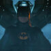 Michael Keaton's Batman sits in a plane in The Flash