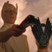 A Martian holding a Martian device in The Martian Chronicles