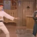 Henry Winkler as Arthur Fonzarelli stands opposite Tom Hanks as Dr. Dwayne Twitchell in Happy Days