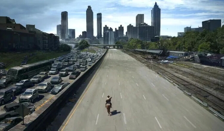 Rick on horseback traveling down an empty highway in The Walking Dead