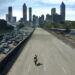 Rick on horseback traveling down an empty highway in The Walking Dead
