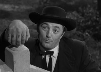 Harry Powell shows off his tattoos in The Night of the Hunter