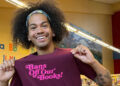 Mychal the Librarian showing off his merchandise