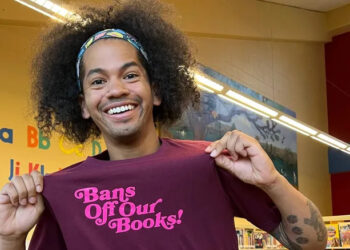 Mychal the Librarian showing off his merchandise