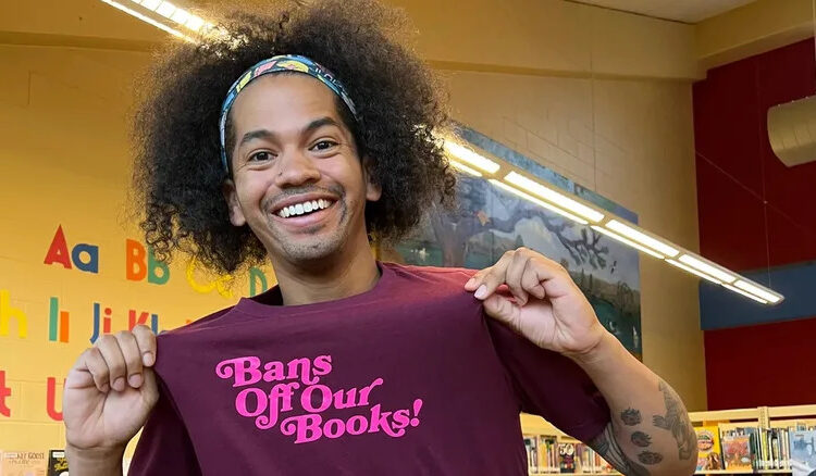 Mychal the Librarian showing off his merchandise