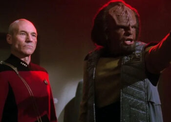 Worf pointing accusitorily with Picard behind him on Star Trek: The Next Generation