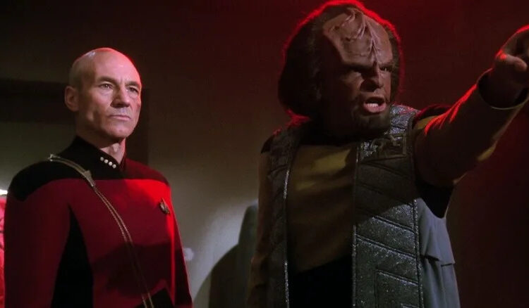 Worf pointing accusitorily with Picard behind him on Star Trek: The Next Generation