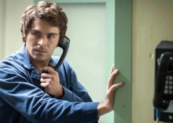 Zac Efron as Ted Bundy holding a phone to his ear in Extremely Wicked, Shockingly Evil and Vile