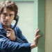Zac Efron as Ted Bundy holding a phone to his ear in Extremely Wicked, Shockingly Evil and Vile