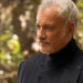 An older Q returns in a black suit for Star Trek: Picard