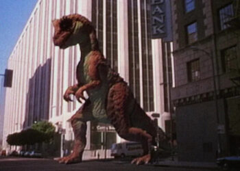 A dinosaur walking down the street in a fake TV commercial in RoboCop