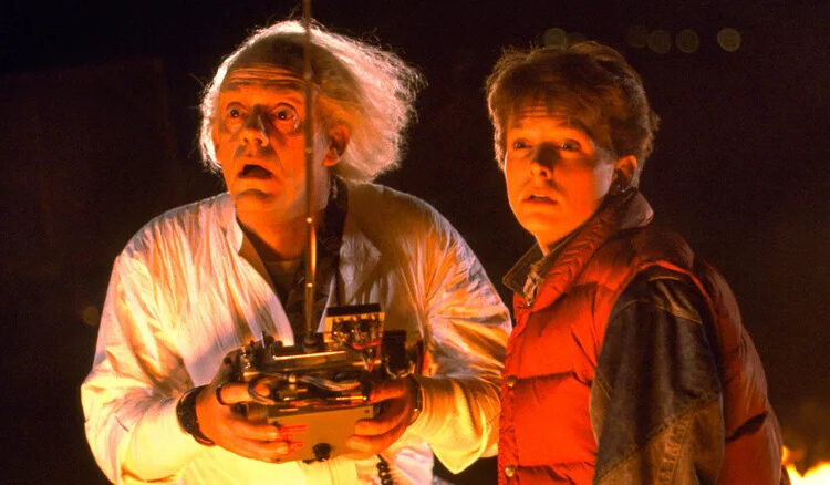 Doc Brown and Marty McFly watching the DeLorean take off in Back to the Future