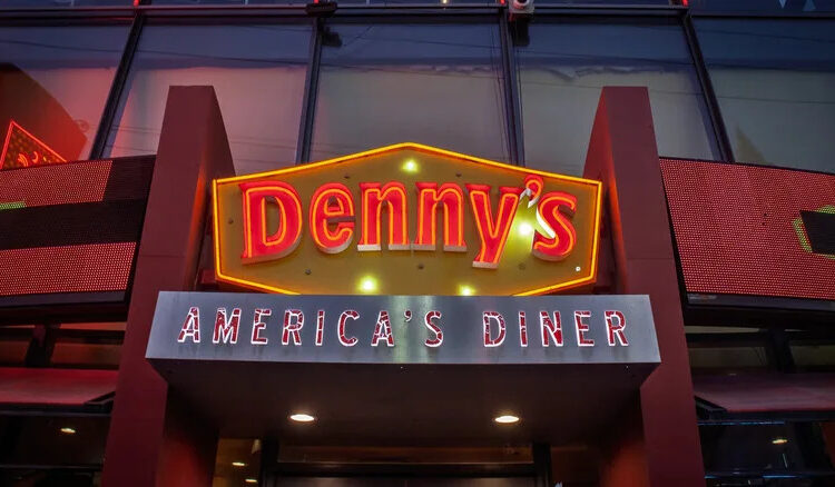 A neon Denny's sign at night