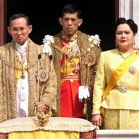The Thai royal family, (L to R) The Thai royal family (L to R) King Bhumibol Adulyadej, Crown Prince Maha Vajiralongkorn and Queen Sirikit receive respects from attending dignitaries in December 1999 - IslanderNews.com