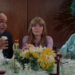 Joan sitting with two older people at a wedding in Lovers and Other Strangers