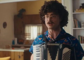 Al playing an accordion in Weird